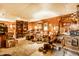 Spacious basement with wood paneling, vintage decor, and ample storage and display shelving at 424 E Vermont St, Indianapolis, IN 46202