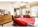 Bright bedroom with natural light, hardwood floors, and a dresser for storage at 424 E Vermont St, Indianapolis, IN 46202