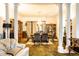 Inviting dining room with classic columns, chandelier, and well-appointed furniture for gracious entertaining at 424 E Vermont St, Indianapolis, IN 46202