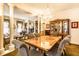 Elegant dining room with a crystal chandelier, complemented by living area, seamlessly connected in an open layout at 424 E Vermont St, Indianapolis, IN 46202