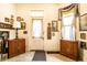 Charming foyer with vintage-style cabinetry and decor elements, creating a warm and inviting entryway at 424 E Vermont St, Indianapolis, IN 46202