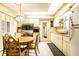 Well-lit kitchen with dining table, classic white cabinets, and functional layout, ready for culinary adventures at 424 E Vermont St, Indianapolis, IN 46202