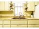 Close-up of a charming kitchen sink with shelving, vintage fixtures, creating an inviting and functional space at 424 E Vermont St, Indianapolis, IN 46202
