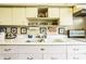 Bright kitchen sink with ample storage and vintage style pulls at 424 E Vermont St, Indianapolis, IN 46202