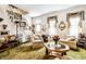 Cozy living room featuring a grand staircase, comfortable seating, and charming decor for a welcoming atmosphere at 424 E Vermont St, Indianapolis, IN 46202