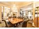 Spacious living area with dining room and seating areas with a large crystal chandelier focal point at 424 E Vermont St, Indianapolis, IN 46202