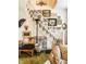 Elegant stairway with white railing, adorned with an eclectic gallery wall for a unique and artistic focal point at 424 E Vermont St, Indianapolis, IN 46202