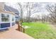 Spacious backyard with deck, patio, fire pit area, and a well-maintained lawn at 4915 E 79Th St, Indianapolis, IN 46250