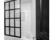 Modern bathroom featuring a subway-tiled shower/tub with glass door and modern fixtures at 4915 E 79Th St, Indianapolis, IN 46250