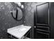 Powder room with pedestal sink and ornate wallpaper at 4915 E 79Th St, Indianapolis, IN 46250