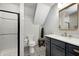 A renovated bathroom featuring a white subway tile shower and black and white patterned tile floors at 4915 E 79Th St, Indianapolis, IN 46250