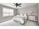 Comfortable bedroom with a ceiling fan and large window offering ample natural light at 4915 E 79Th St, Indianapolis, IN 46250
