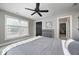 Inviting bedroom with a ceiling fan, large window, and stylish decor creating a cozy atmosphere at 4915 E 79Th St, Indianapolis, IN 46250