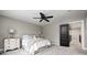 Bedroom with a ceiling fan, black door, and neutral tones for a relaxing retreat at 4915 E 79Th St, Indianapolis, IN 46250