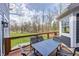 Open-air deck with table and chairs offers a great view of backyard at 4915 E 79Th St, Indianapolis, IN 46250