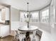 Charming dining area with banquette seating, wood floors, and bay windows at 4915 E 79Th St, Indianapolis, IN 46250