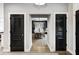 Elegant dining room with a modern chandelier, wood floors, and stylish furnishings at 4915 E 79Th St, Indianapolis, IN 46250