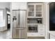 Stainless refrigerator and microwave with custom cabinets and hardware at 4915 E 79Th St, Indianapolis, IN 46250