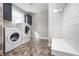 Modern laundry room featuring stylish flooring, cabinetry, bench, and new washer and dryer at 4915 E 79Th St, Indianapolis, IN 46250