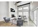 Bright living room with soaring ceilings, fireplace, large windows, and modern furnishings at 4915 E 79Th St, Indianapolis, IN 46250
