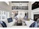 Bright living room with open floor plan, fireplace, second story overlook, and comfortable seating at 4915 E 79Th St, Indianapolis, IN 46250
