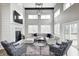 Spacious living room with a cozy fireplace, soaring ceilings, and stylish seating arrangement at 4915 E 79Th St, Indianapolis, IN 46250