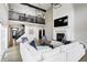 Open-concept living room boasts a fireplace, high ceilings, and a view of the second-story balcony at 4915 E 79Th St, Indianapolis, IN 46250
