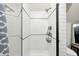 A subway tile shower with black trim and gold hardware at 4915 E 79Th St, Indianapolis, IN 46250