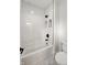 Bright bathroom with white subway tile, black hardware, and built in shelving at 5123 Oak Ridge Pl, Columbus, IN 47201