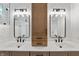 This bright bathroom features double sinks with modern fixtures and storage at 5123 Oak Ridge Pl, Columbus, IN 47201