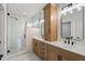 A modern bathroom showcases a glass enclosed shower and double sink vanity at 5123 Oak Ridge Pl, Columbus, IN 47201