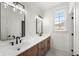 Bathroom featuring a white countertop, wood cabinets, and modern black fixtures at 5123 Oak Ridge Pl, Columbus, IN 47201