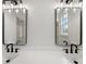 Bathroom with a white countertop, double sinks, and modern lighting fixtures at 5123 Oak Ridge Pl, Columbus, IN 47201