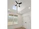Bedroom with a vaulted ceiling, ceiling fan, two windows, and a closet at 5123 Oak Ridge Pl, Columbus, IN 47201