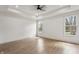 This empty bedroom features recessed lighting and large windows overlooking the backyard at 5123 Oak Ridge Pl, Columbus, IN 47201