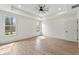 An empty bedroom showcases two bright windows and neutral paint at 5123 Oak Ridge Pl, Columbus, IN 47201