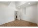 Spacious room with hardwood flooring, natural lighting, and an ensuite bathroom at 5123 Oak Ridge Pl, Columbus, IN 47201