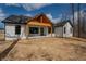 New construction home featuring a covered porch with wood ceiling and a spacious backyard at 5123 Oak Ridge Pl, Columbus, IN 47201