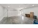 Spacious three car garage with ample room for storage and equipped with an automatic door at 5123 Oak Ridge Pl, Columbus, IN 47201