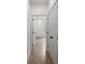 Hallway with doors leading to bedrooms, showcasing wood floors and trim at 5123 Oak Ridge Pl, Columbus, IN 47201