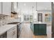 Well-designed kitchen with quartz countertops, a center island, and stainless steel appliances at 5123 Oak Ridge Pl, Columbus, IN 47201