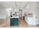 New kitchen with a center island, designer backsplash, stainless appliances, and custom cabinets at 5123 Oak Ridge Pl, Columbus, IN 47201