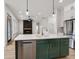 Kitchen with center island, quartz countertops, stainless steel appliances, and modern finishes at 5123 Oak Ridge Pl, Columbus, IN 47201
