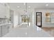 Close up view of a large kitchen island with seating, quartz countertops, and modern faucet at 5123 Oak Ridge Pl, Columbus, IN 47201