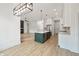 Open concept kitchen featuring stainless steel appliances, a kitchen island, and hardwood floors at 5123 Oak Ridge Pl, Columbus, IN 47201