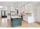 Well-appointed kitchen features a center island, white cabinets, and stainless steel appliances at 5123 Oak Ridge Pl, Columbus, IN 47201