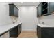 Laundry room features green cabinets, light countertops and hardwood flooring at 5123 Oak Ridge Pl, Columbus, IN 47201