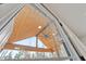View of a living room with wood ceiling and a ceiling fan, as seen through a window at 5123 Oak Ridge Pl, Columbus, IN 47201