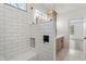 This bright shower features a built-in bench and modern hardware at 5123 Oak Ridge Pl, Columbus, IN 47201