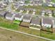 Aerial view of new construction homes, some with fenced in backyards at 5150 Bramwell Ln, Whitestown, IN 46075